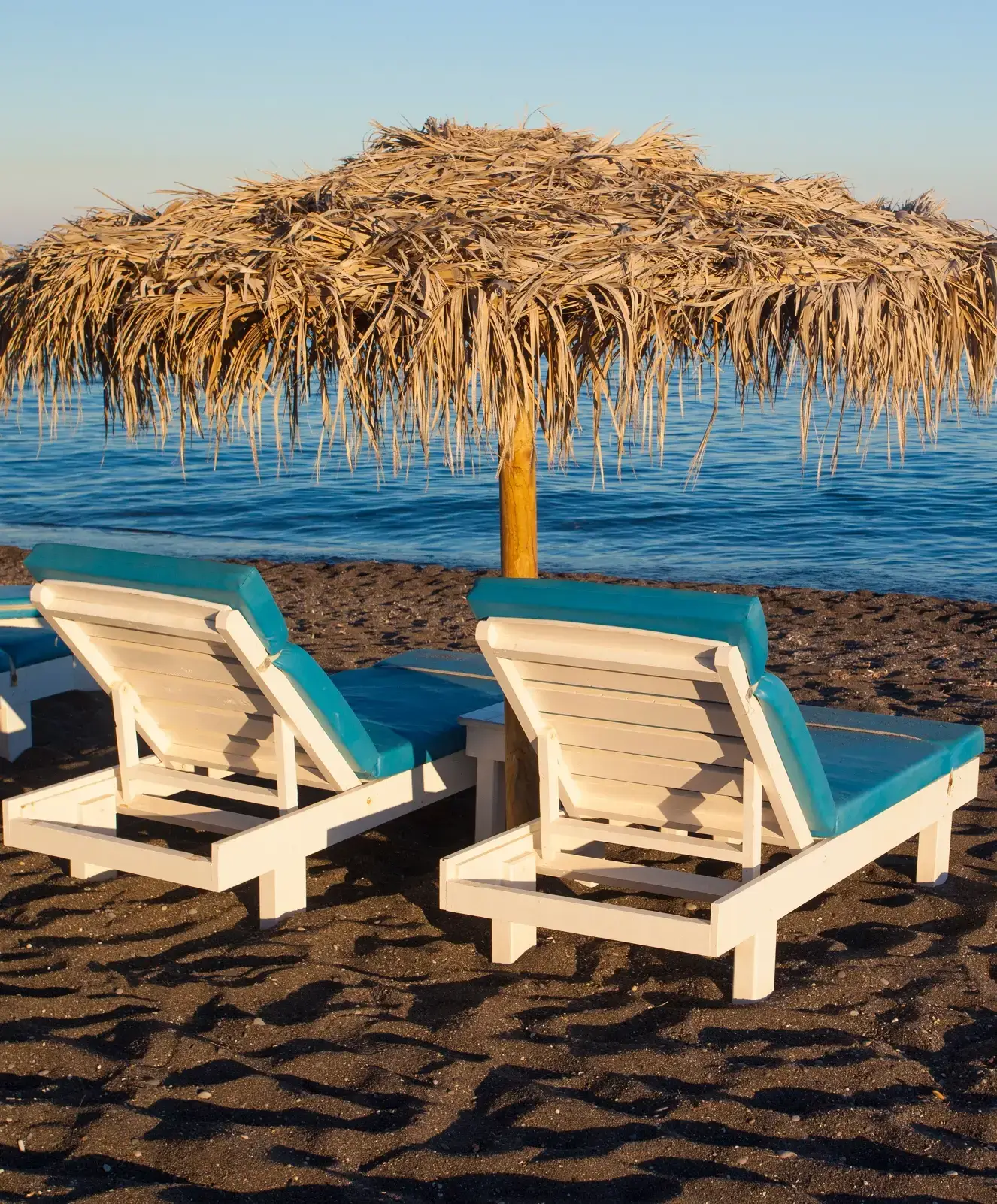 Lounge chairs and umbrella on the beach
